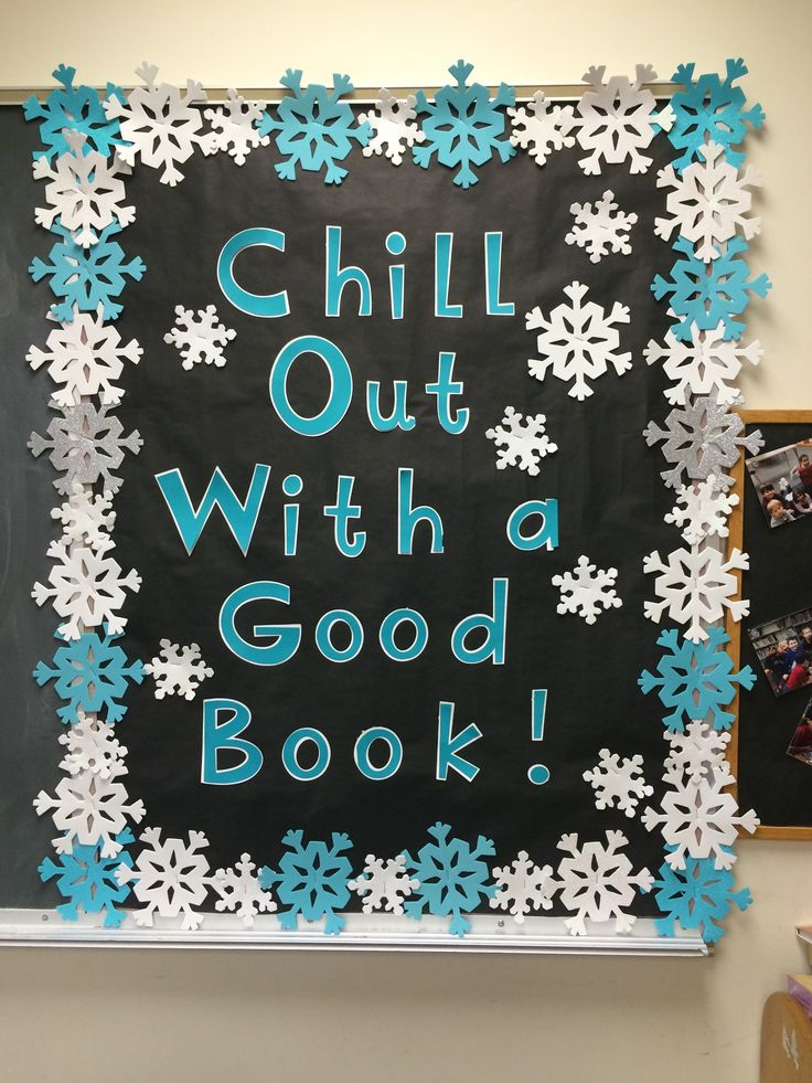 a bulletin board with the words chill out with a good book written in blue and white snowflakes