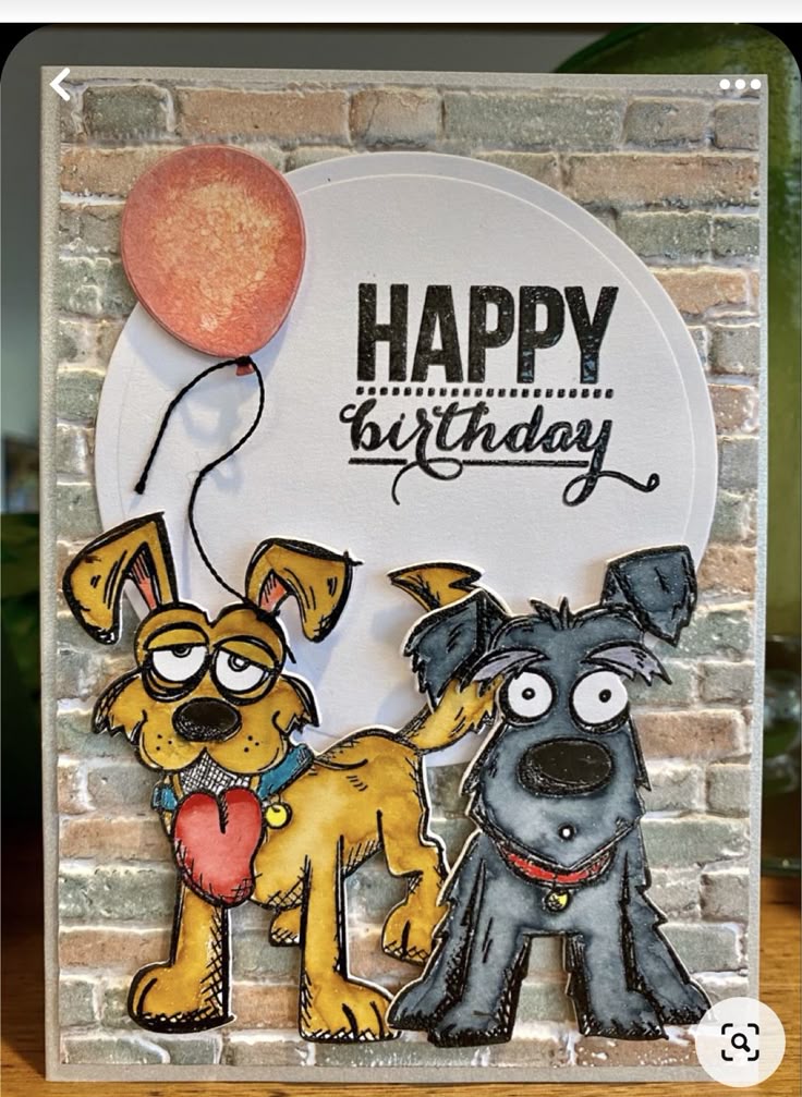 a birthday card with two dogs and a balloon