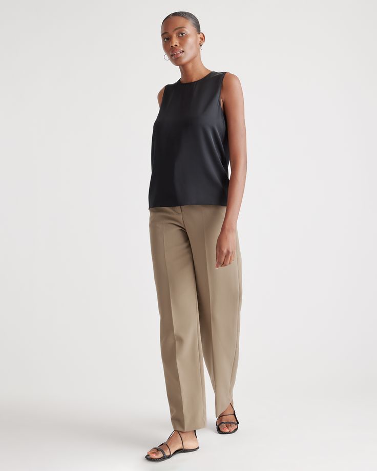 Quiet luxury meets everyday comfort in our Washable Stretch Silk Shell Tank. This whisper-light top is crafted from best-in-class mulberry silk with a hint of stretch for an ideal combination of softness and flexibility. Layered under a blazer or worn alone, its timeless design is elevated enough for special occasions yet stands up to daily wear. Best part? It's washable!  | Quince | Women's Washable Stretch Silk Shell Tank Top in Black, Size Large, Mulberry Silk Elegant Sleeveless Tops For Business Casual, Silk Tank Top For Workwear In Spring, Chic Silk Tank Top For Work, Versatile Sleeveless Top For Business Casual, Sleek Stretch Tops For Workwear, Sleek Stretch Tops For Work, Elegant Tailored Sleeveless Tops, Sleek Stretch Viscose Tops, Sleek Sleeveless Blouse For Work