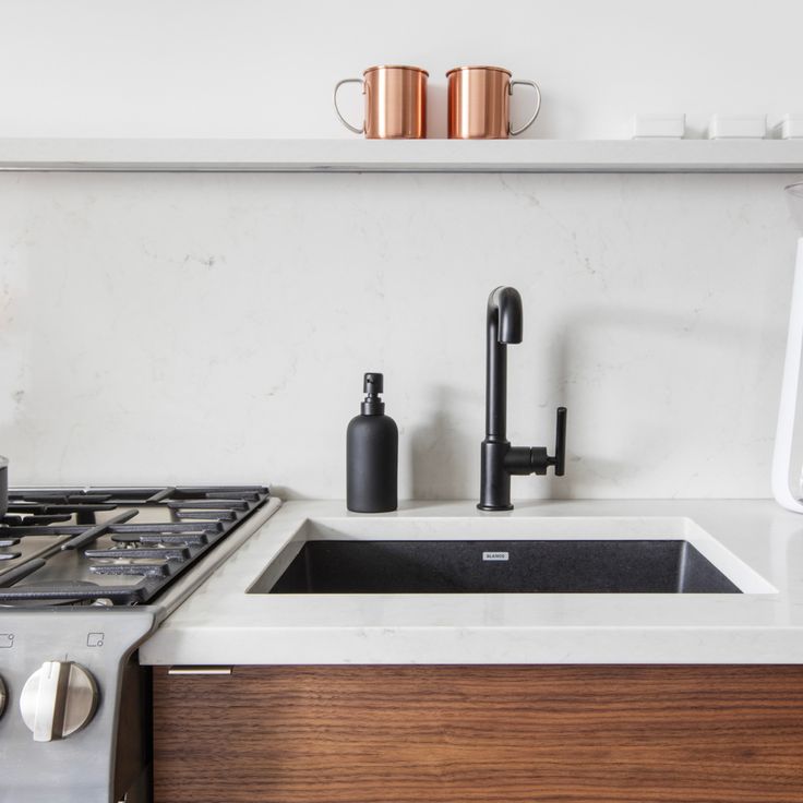 the kitchen sink is clean and ready to be used as a faucet for soap dispensers