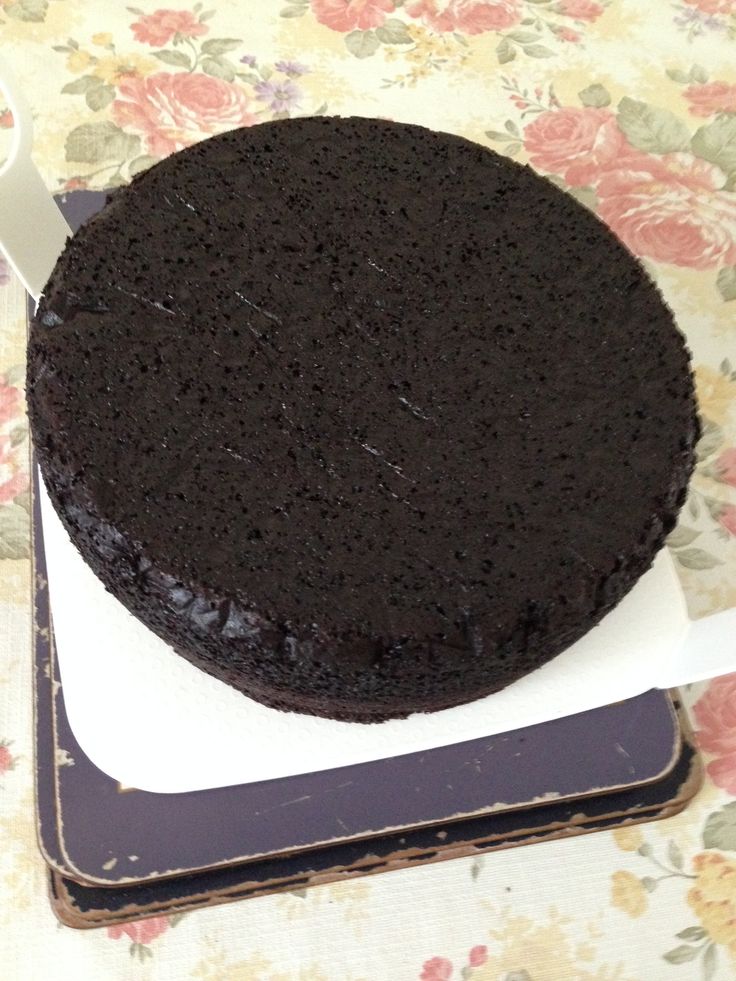 a chocolate cake sitting on top of a white plate