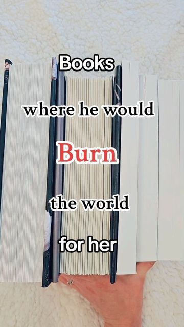 a person is holding an open book with the words, books where he would burn the world for her