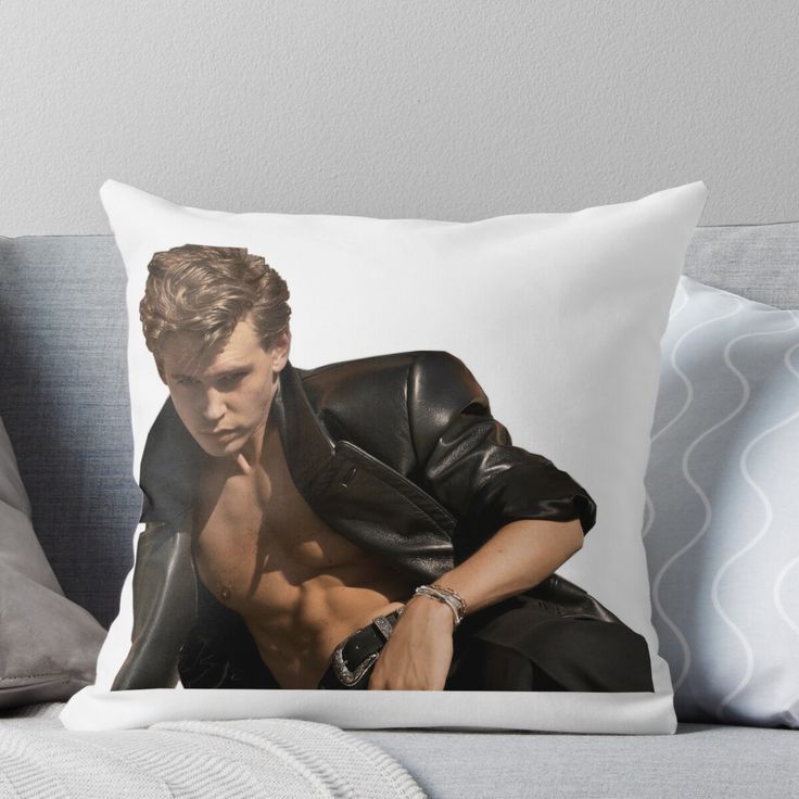 a man in black jacket sitting on a couch with his shirt open throw pillow cover