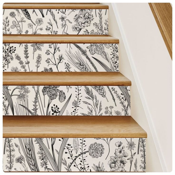 the stairs are decorated with floral wallpaper and decorative stickers for decorating them