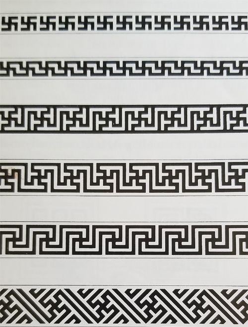 black and white patterns are arranged on a piece of paper that has been cut into squares