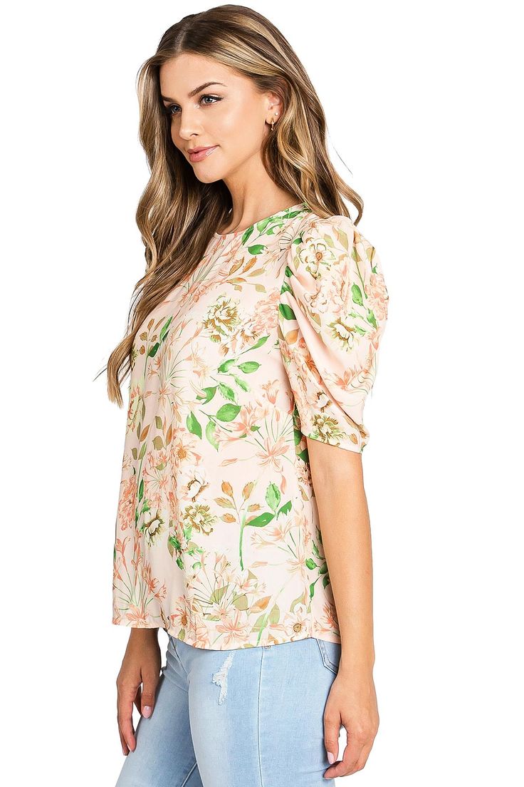 Light, chiffon blouse with a whimsical, floral print. Round neckline with a relax fit and a puff shoulder, short sleeve. Chic and effortless top, looks great paired with denim. CARE | Dry Clean or Hand Wash Cold CONTENTS | 100% Polyester MEASUREMENTS | 25"/63 cm Shoulder to Hem (Size Small) MODEL | 5'8 - wearing a size Small IMPORTED Spring Flutter Sleeve Printed Blouse, Feminine Floral Print Blouse With Flutter Sleeves, Printed Short Sleeve Tops For Brunch, Trendy Relaxed Fit Puff Sleeve Top, Spring Floral Print Flutter Sleeve Blouse, Floral Print Flutter Sleeve Tops For Brunch, Flutter Sleeve Floral Print Top For Brunch, Casual Printed Flutter Sleeve Blouse, Casual Floral Print Short Sleeve Top For Summer