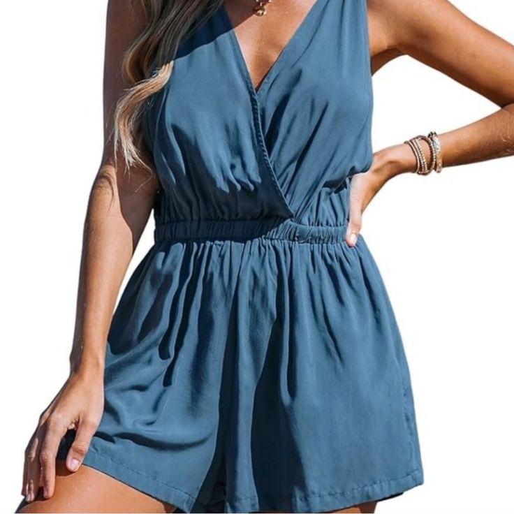 Walk On The Beach In This Pair Of Cover-Up Trousers Featuring A High-Rise Waist, Sleeveless, And A V-Neckline. Fabric Type:100% Rayon Pit To Pit 15" Length: 29" C69 Beach V-neck Solid Color Jumpsuits And Rompers, Summer Beach Solid Color Jumpsuits And Rompers, Summer Jumpsuits And Rompers In Solid Color, V-neck Solid Color Jumpsuits And Rompers For Vacation, V-neck Jumpsuits And Rompers For Beach Day Out, Blue Chic Jumpsuits And Rompers For Beach Season, Blue Jumpsuits And Rompers For Summer Brunch, Chic Blue Jumpsuits And Rompers For Beach Season, Blue Chic Jumpsuits For Beach Season