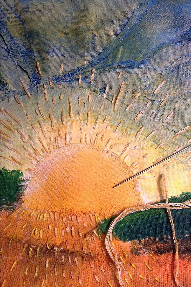 a painting with some scissors in the middle of it and an image of a sun