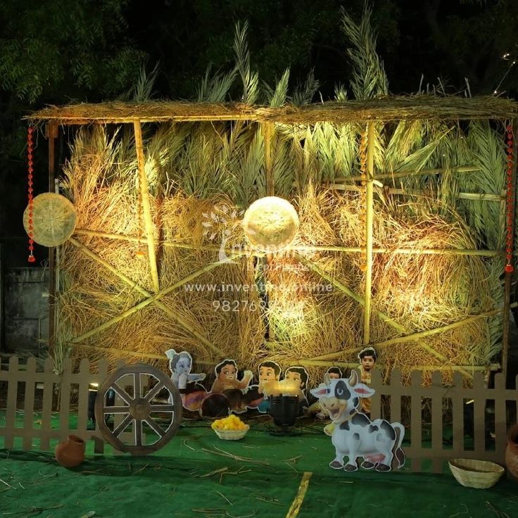 an outdoor stage set up with hay and decorations