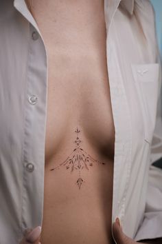 a woman with a tattoo on her chest