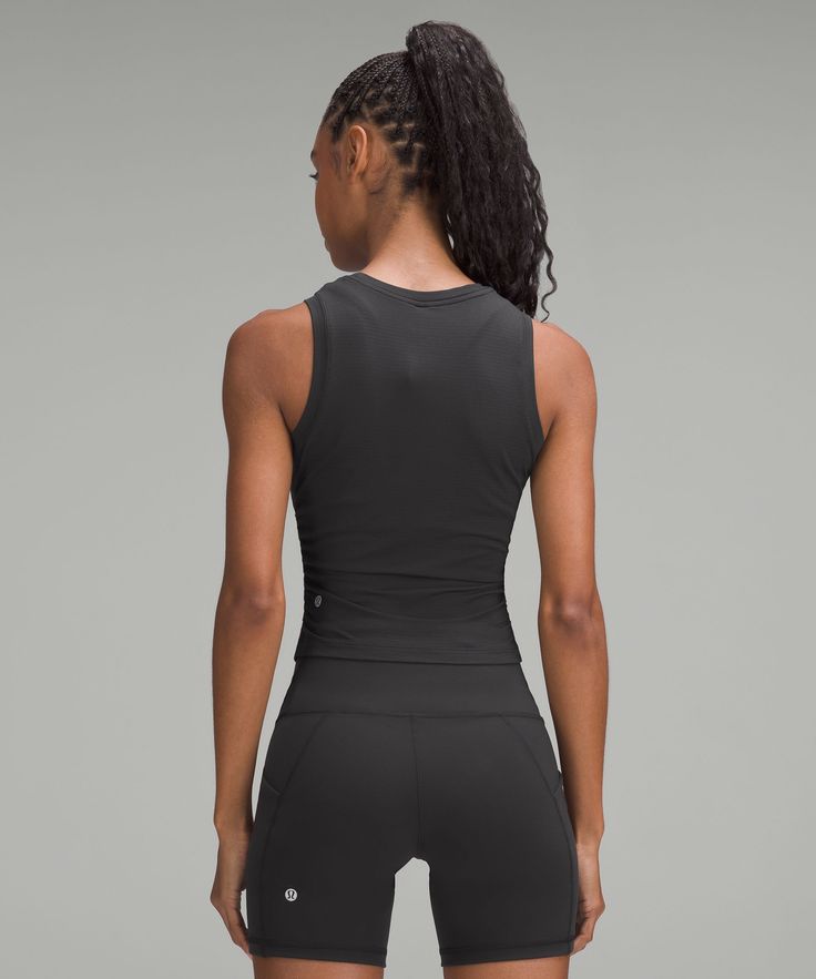 The Key To Crushing Your Gym Goals Is To Train Without Distractions. This Soft, Fitted Top Stays Out Of Your Way So You Can Keep The Reps Coming. Designed For Training. Contours Your Body:not Too Short, Not Too Long, Just Right Around The Waistband. Side Cinch Detail Keeps The Fit Close And Moves With You. This Garment Was Treated With No-Stink Zinc To Inhibit The Growth Of Odour-Causing Bacteria On The Fabric. | License to Train Tight-Fit Tank Top Functional Sleeveless Lululemon Tops, Black Lululemon Tops, Fitted Lululemon Functional Tank Top, Fitted Sleeveless Lululemon Activewear, Black Lululemon Yoga Tops, Lululemon Black Yoga Top, Lululemon High Stretch Workout Tops, Versatile Lululemon Tops For Yoga, Lululemon Stretch Sleeveless Top