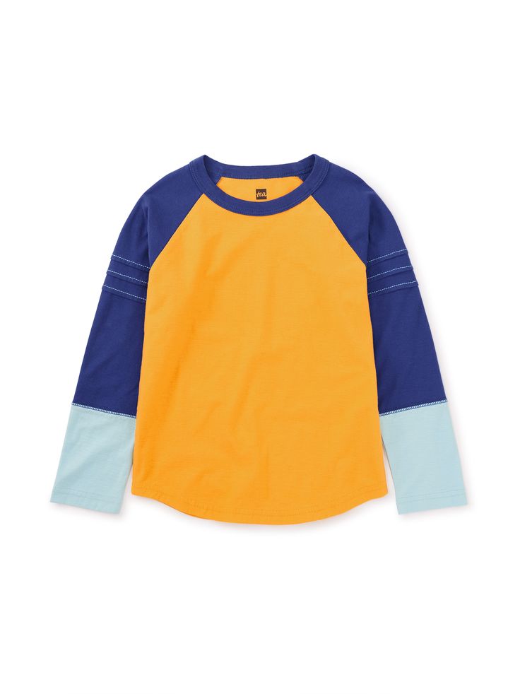 This customer fave is such a standout piece: Sporty but polished, our striking Explorer Colorblock Raglan Top elevates jeans or joggers. Long raglan sleeves with handsome pintuck detailing. Crafted from 100% soft cotton jersey. Fall Cotton Tops With Contrast Panels, Cotton Tops With Contrast Panels For Fall, Casual Playwear Tops With Ribbed Cuffs, Sporty Graphic Print T-shirt With Raglan Sleeves, Sporty Blue T-shirt With Raglan Sleeves, Cheap Raglan Sleeve T-shirt, Casual Color Block Raglan Sleeve T-shirt, Sporty Stretch Raglan Sleeve T-shirt, Raglan Top