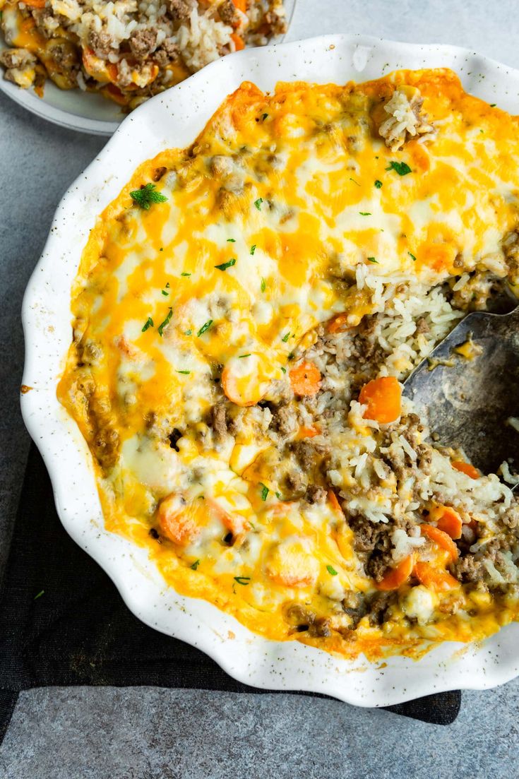 a casserole dish with meat and rice in it