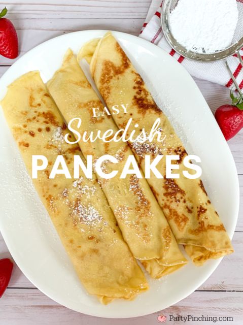 pancakes on a white plate with strawberries and powdered sugar in the background text reads easy swedish pancakes