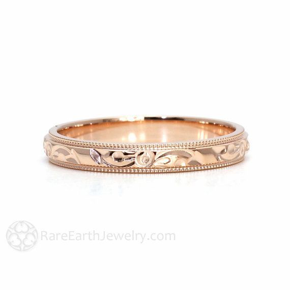 a wedding band with an intricate design on it