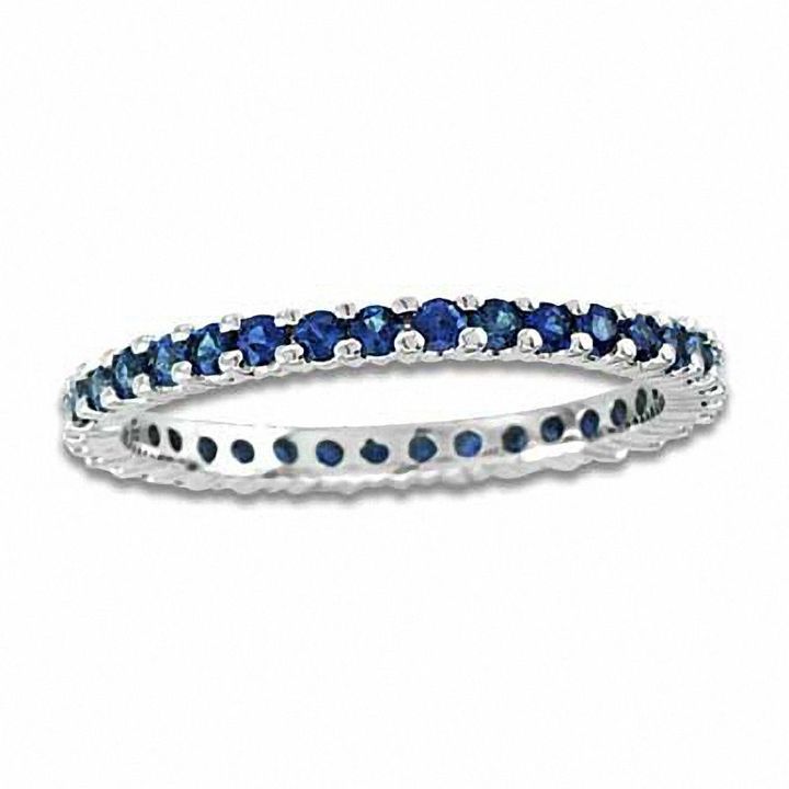 a white gold ring with blue sapphire stones