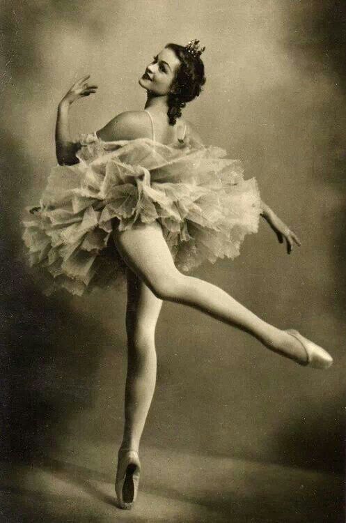 an old black and white photo of a ballerina