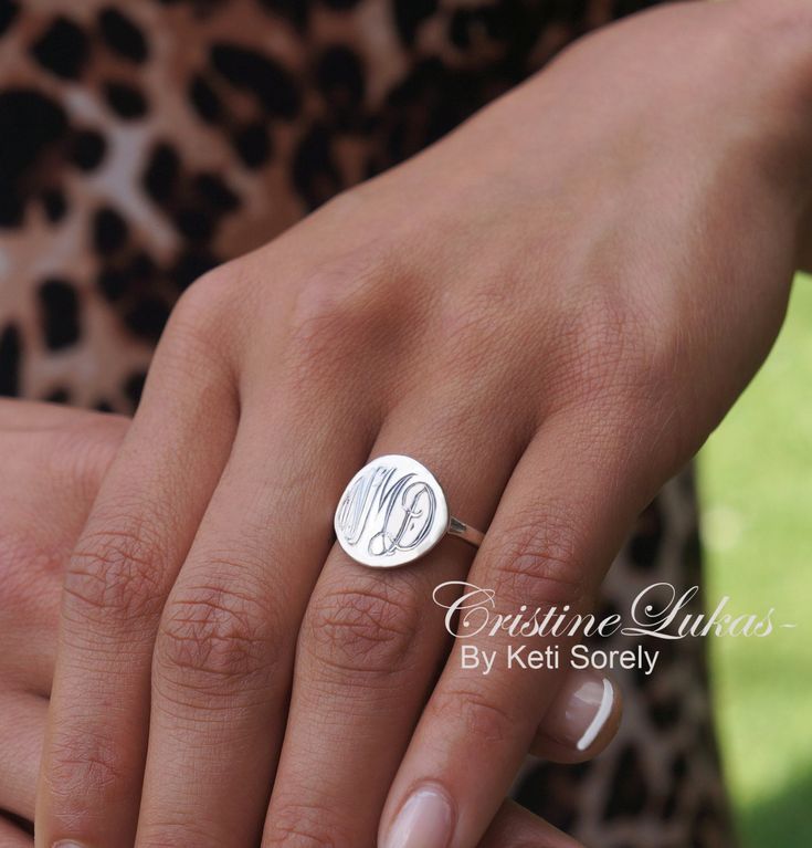 "Dainty monogram ring. Hand engraved round disc ring with your initials etched into the metal. Ring will be made in 10K Gold, 14K gold or 18K Gold. Order any initials and they will be hand engraved by our talented jewelers. Design by Keti Sorely. Metal options: - 10K Gold (Yellow, Rose or White) - 14K Gold (Yellow, Rose or White) - 18K Gold (Yellow, Rose or White) Ring disc measures approximately 3/4\" in diameter. Band width - 2mm Ring sizes available: 5 to 11 US -------------NOTE---------- Tra Formal Round Monogram Jewelry, Formal Monogram Round Jewelry, Sterling Silver Initial Ring For Wedding, White Gold Monogram Ring Jewelry, White Gold Monogram Ring, Monogrammed White Gold Ring, Personalized Fine Jewelry Initial Ring With Round Band, Luxury Personalized Sterling Silver Initial Ring, Personalized White Gold Initial Ring With Round Cut