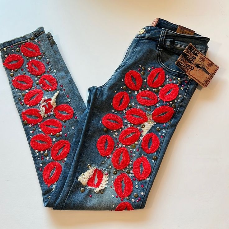 Jill Koo- Lips, Red Embroidered Denim Jeans, 28, Skinny 30” Inseam 14” Waist 9” Rise One Of A Kind, Artsy Embellished/Embroidered Skinny Jeans. Studs, Jewels, Valentine, Lips, Smooch, Kiss Trendy Embroidered Denim Jeans, Embroidered Dark Wash Jeans For Fall, Fitted Embroidered Dark Wash Jeans, Fitted Dark Wash Embroidered Jeans, Fall Season Embroidered Dark Wash Jeans, Embellished Fitted Dark Wash Jeans, Fitted Cotton Jeans With Multicolor Embroidery, Trendy Embroidered Mid-rise Jeans, Trendy Embroidered Fall Jeans