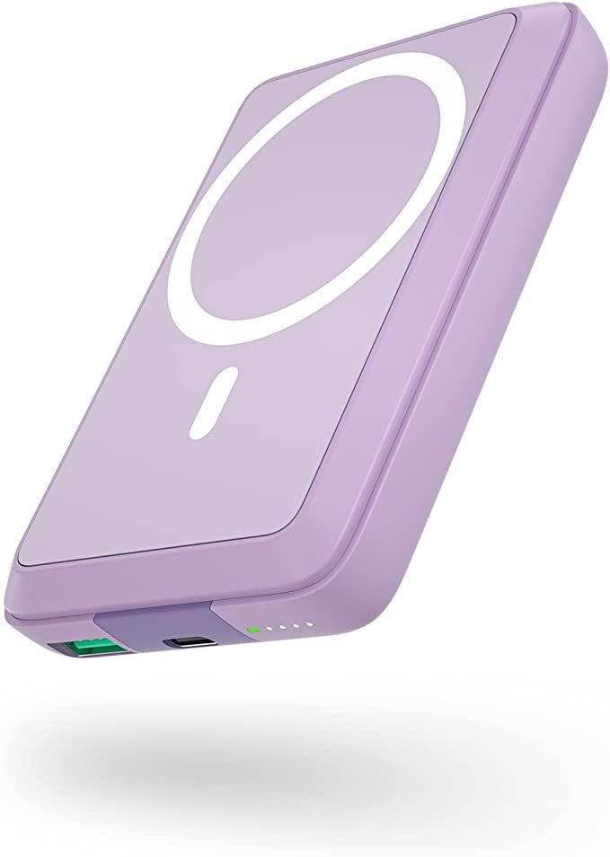 an electronic device with a purple cover on the front and back sides, is flying through the air