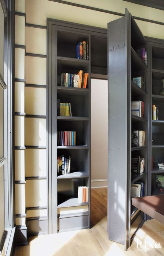 an open bookcase in the corner of a room