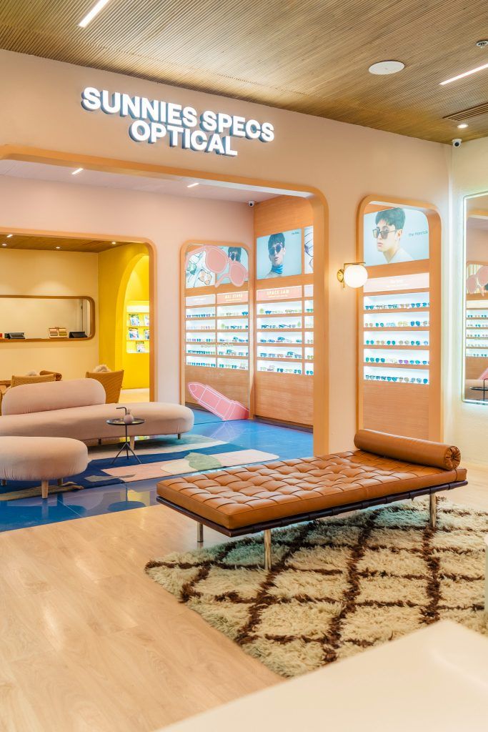 the inside of a store with sun glasses on display