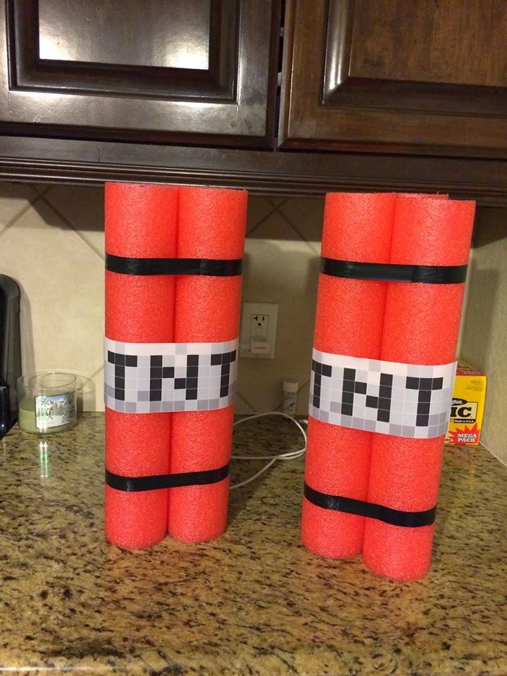 two orange fire extinguishers sitting on top of a counter