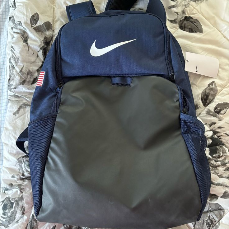 Brand New Navy Blue Usa Backpack Unused With Original Tags Sporty Navy Standard Backpack, Nike Standard Backpack, Nike Backpack For Daily Use Back To School, Nike Black Backpack For Daily Use, Nike Backpack For Back To School, Nike Student Backpack, Nike Backpack For Travel And Back To School, Nike Travel Backpack With Adjustable Strap, Navy Rectangular School Bag