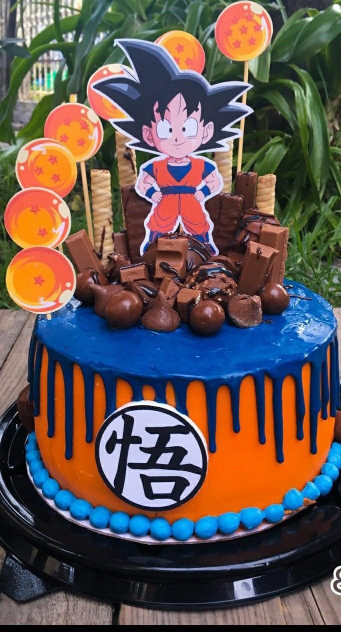 a dragon ball cake is decorated with fondant and decorations