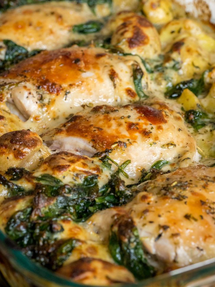 chicken and spinach casserole in a glass dish