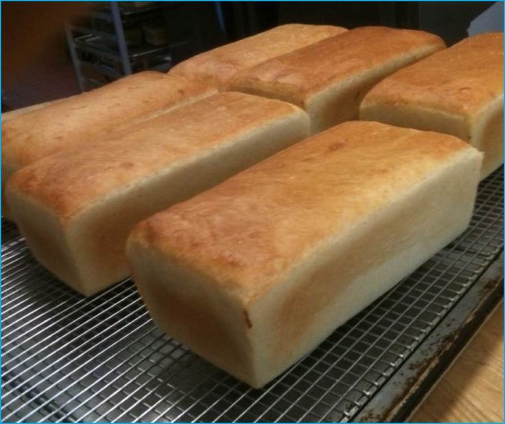 four pieces of bread sitting on top of a cooling rack