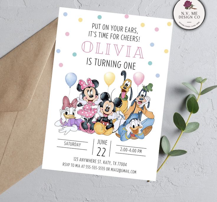 a birthday party with mickey mouse and friends on it's card, next to a brown envelope