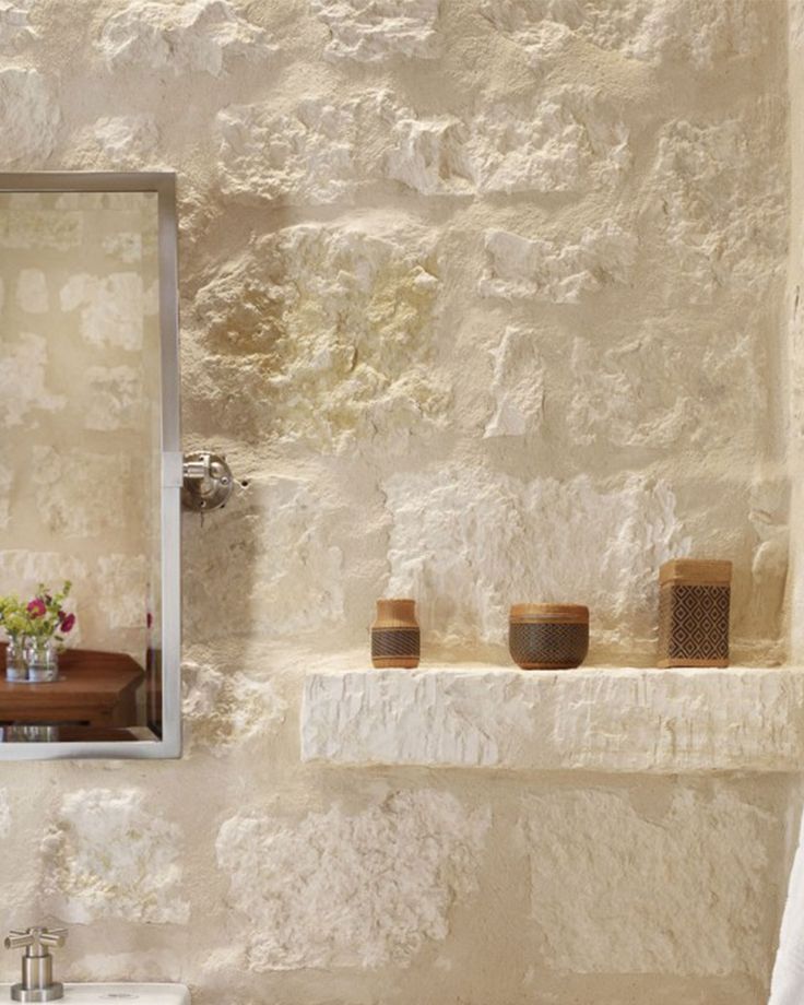 a bathroom with a sink and mirror in it