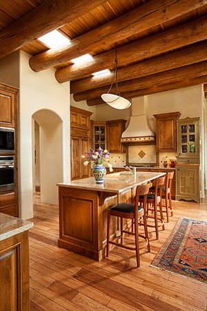 a kitchen with wooden floors and an island