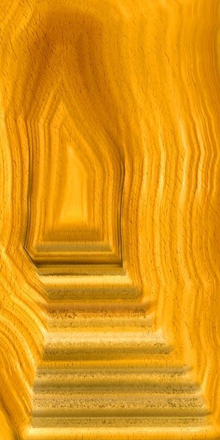 an image of a long yellow tunnel with steps going up to the top and bottom