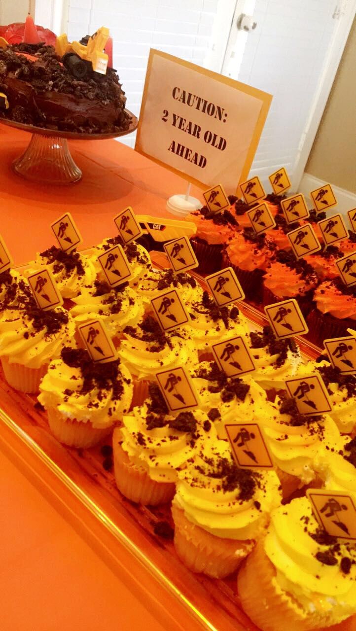 cupcakes are arranged on an orange table