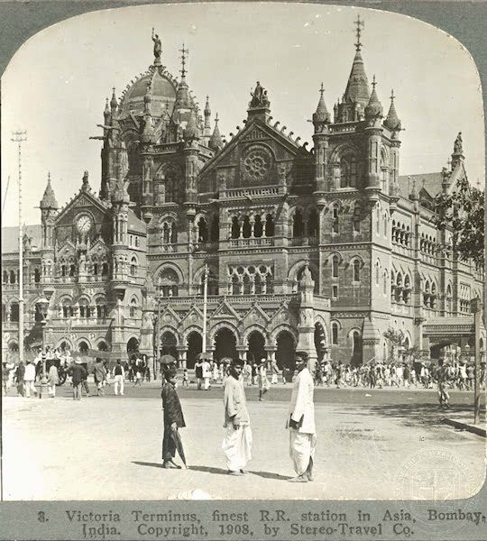 an old black and white photo of people in front of a large building with many spires