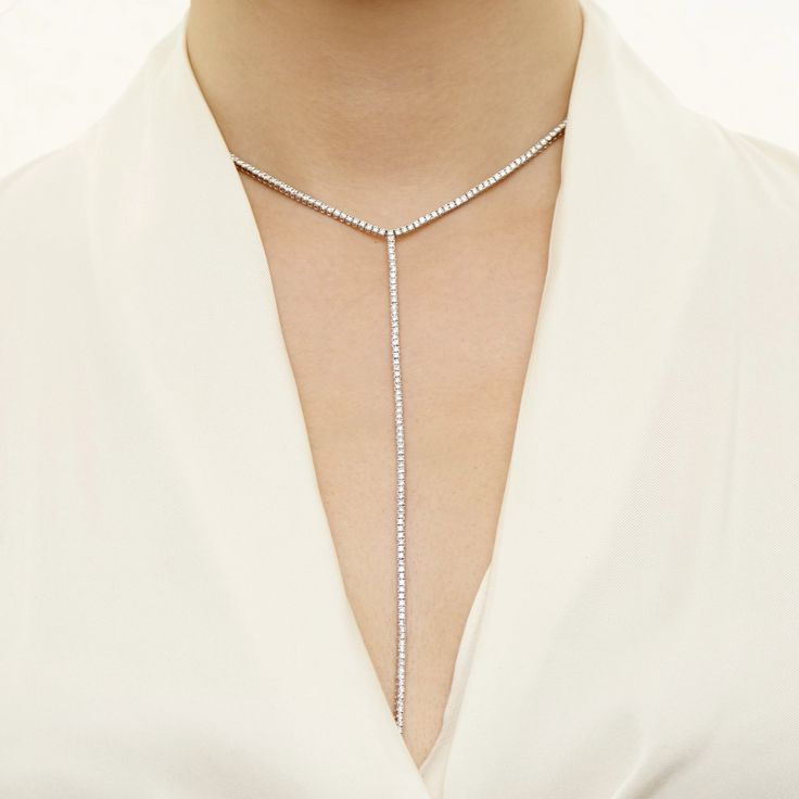 Why We Love It: A statement piece by definition, this lariat necklace boasts 209 round-cut diamonds and calls for a plunging neckline to frame its long length. ﻿ Shop the full Tennis Collection. Formal Diamond Drop Necklace, Formal Lariat Diamond Necklace, Formal Lariat Diamond Necklace Fine Jewelry, Formal White Gold Lariat Diamond Necklace, Formal Lariat Diamond Necklace In Fine Jewelry Style, White Gold Lariat Diamond Necklace For Formal Occasions, Formal Brilliant Cut Lariat Diamond Necklace, Formal Diamond Drop Necklace With Adjustable Chain, Fine Jewelry Diamond Lariat Drop Necklace