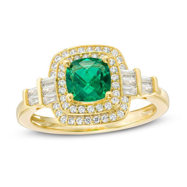 Top off your favorite looks with this glamorous fashion ring. Crafted in sterling silver with 14K gold plate, this Art Deco-inspired choice features a 6.0mm cushion-cut lab-created verdant-green emerald wrapped in a double frame of shimmering lab-created white sapphires. A stepped arrangement of baguette-cut created sapphires flanks the center stone. Buffed to a brilliant luster, this design expresses your sophisticated style. Custom-made to fit her ring size. Sterling silver rings cannot be res Gold Baguette Cut Ring With Halo Setting, Gold Rings With Halo Setting In Baguette Cut, Gold Art Deco Ring With Halo Setting, Art Deco Gold Rings With Halo Setting, Gold Art Deco Rings With Halo Setting, Elegant Gold Emerald Ring With Polished Finish, Art Deco Gold Ring With May Birthstone, Gold Emerald-cut Halo Ring Fine Jewelry, Gold Ring With May Birthstone In Fine Jewelry Style