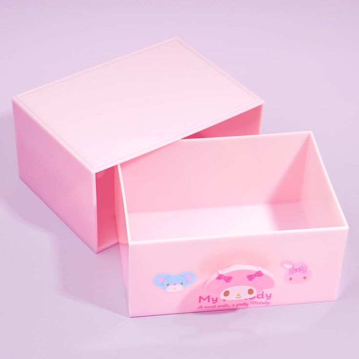 two pink boxes with hello kitty stickers on the lid and bottom one is open