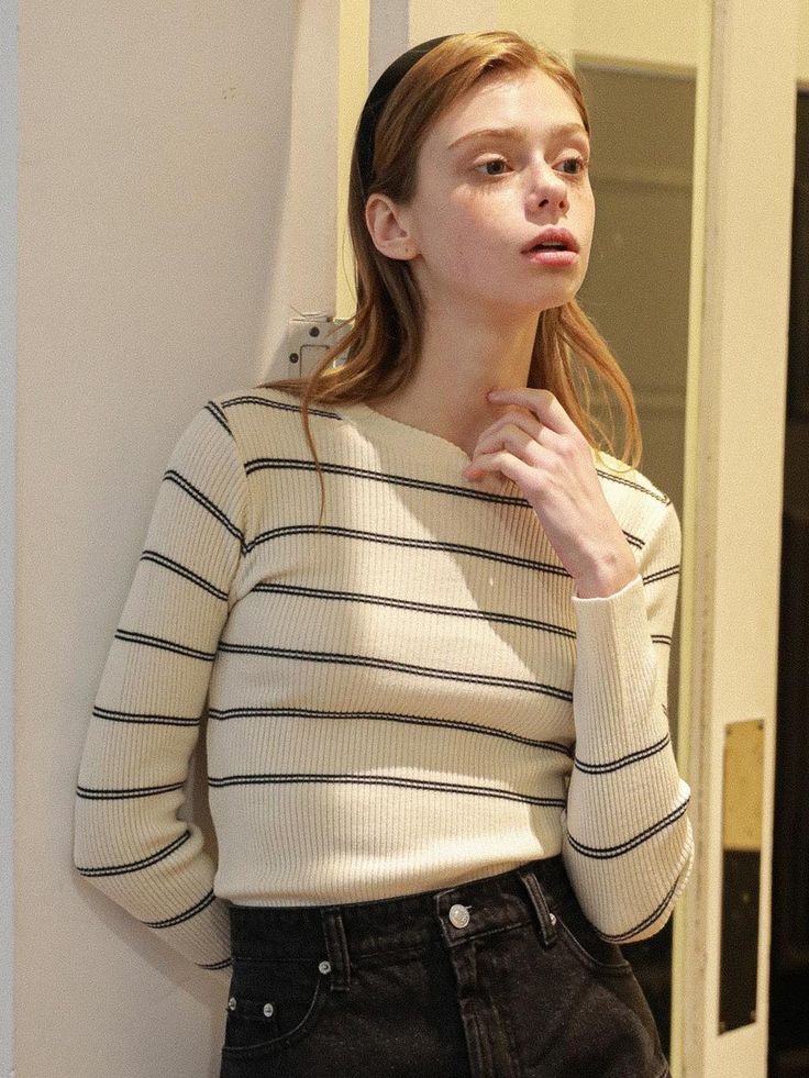 This product is a classic striped round knitwear, offering a timeless design that pairs well with a variety of bottoms. The ribbed texture and fitted silhouette provide a sleek appearance, making it a staple for both casual and smart-casual looks. It's an essential piece for anyone looking to add a sophisticated yet comfortable item to their wardrobe. - Striped design adds a bold, graphic element to the knitwear, allowing for easy styling with simple or layered outfits.- Ribbed texture not only contributes to the aesthetic but also ensures a snug and flexible fit.- Crafted with a blend of materials that offer durability and softness for everyday wear.- The round neckline complements various body types and adds a clean line to the neck area. Striped Knit Sweater For Work, Chic Striped Fitted Sweater, Classic Striped Tops With Ribbed Cuffs, Classic Striped Sweater With Ribbed Cuffs, Stretch Striped Ribbed Sweater, Classic Striped Crew Neck Sweater, Classic Striped Knit Sweater, Striped Sweater For Work, Classic Striped Sweater For Work