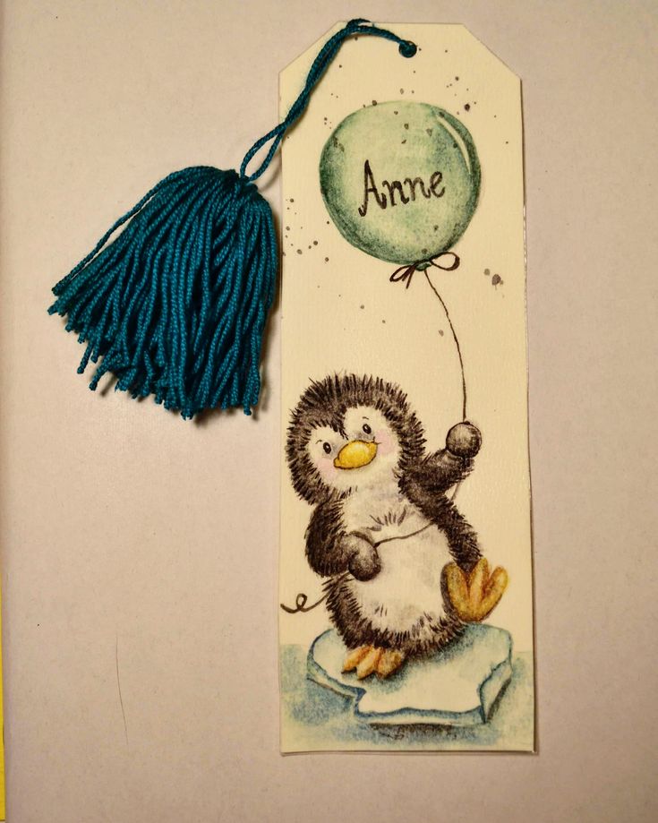 a bookmark with an image of a penguin holding a balloon