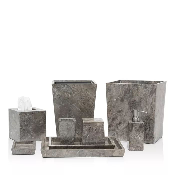 marble bathroom accessories including soap dispenser, toothbrush holder and tissue dispenser