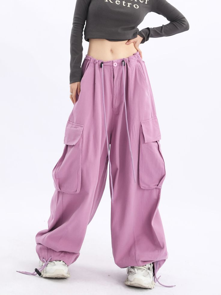 Step out in style with our Acubi Wide Leg Baggy Track Pants. These Y2K-inspired streetwear essentials feature a relaxed fit, drawstring waist, and plenty of pockets, ensuring a comfortable and trendy look. High Waist Cotton Parachute Pants With Multiple Pockets, High-waist Cotton Parachute Pants With Multiple Pockets, Baggy Casual Cargo Pants With Pockets, Baggy Cargo Pants With Cargo Pockets, Relaxed Fit Cargo Trousers With Multiple Pockets, Relaxed Fit Wide-leg Utility Cargo Pants, Streetwear Harem Pants With Cargo Pockets, Streetwear Full-length Harem Pants With Cargo Pockets, Streetwear Full Length Harem Pants With Cargo Pockets