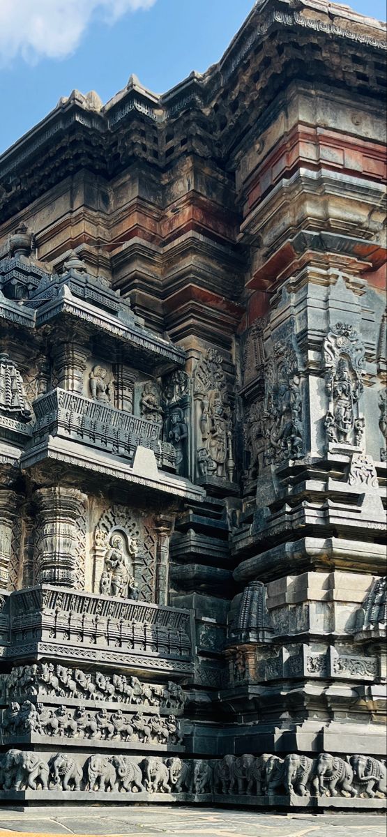 an intricately carved building with statues on it