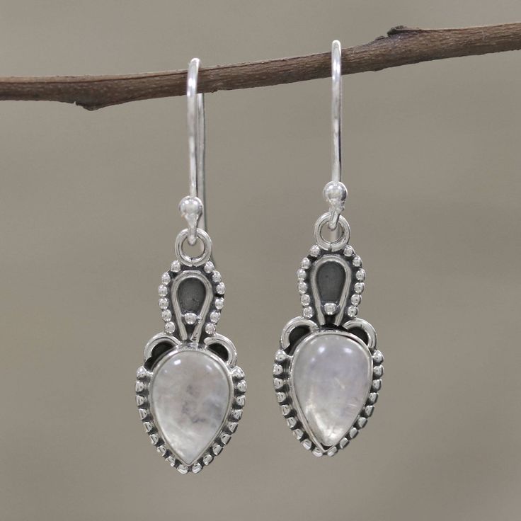 Considered by some to aid clarity of mind, rainbow moonstone is intriguing in these earrings from Alok Jain. Artisans set the cabochon gems in sterling silver bezels and surround them with silver rawa or granules. Contrasting oxidization adds interest to the unique earring design. The earrings swing from sterling silver hooks. Clarity Of Mind, Unique Earring, Moonstone Pendant Necklace, Moonstone Cabochon, Peridot Earrings, Ruby Pendant, Moonstone Pendant, Necklace Sizes, Henna Tattoo