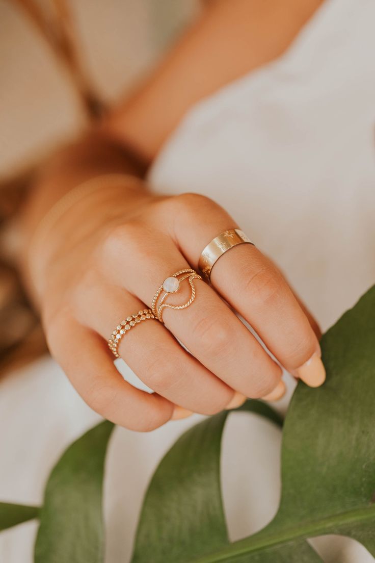 Originally designed to be paired with one of our Gemstone Rings, our Dune Ring stacks beautifully with any Stacking Bands and can hold it's own as a solo ring, too. Twisted wire is hand-shaped and made into a unique stacking ring. Available in 14kt Gold Fill + Sterling Silver. Handmade in Eau Claire, WI. Our jewelry is handmade so each piece will be unique and may vary slightly from what is pictured. Ring Stacks, Backdrops Necklace, Zodiac Rings, Hoop Charms, Stacking Bands, Silver Stacking Rings, Twisted Wire, Jewelry Case, Stacking Ring