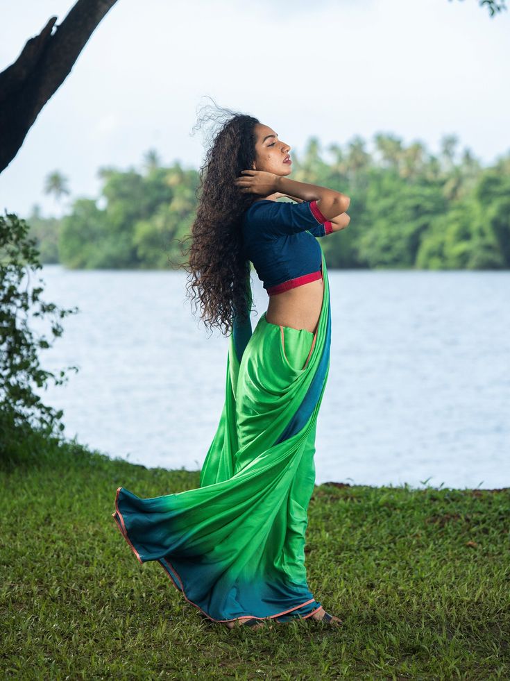 THE KAITHARI PROJECT This cotton saree is a double shade of green and blue with peach edging Pairs beautifully with a green, blue or pink blouse. Dry wash only Green Cotton Silk Pre-draped Saree For Festivals, Green Pre-draped Cotton Silk Saree With Pallu, Green Cotton Silk Pre-draped Saree With Pallu, Green Cotton Silk Blouse Piece With Traditional Drape, Green Cotton Silk Choli With Traditional Drape, Green Bollywood Cotton Silk Choli, Green Handloom Cotton Silk Saree, Green Bollywood Style Cotton Silk Choli, Green Cotton Silk Handloom Saree