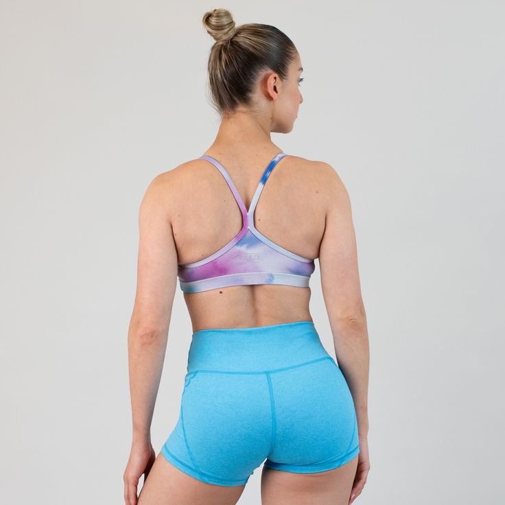 Classic & carefree, Cami is an easy-going, wear-all-day kind of bra. The u-shaped neckline provides medium coverage & low support, while the racerback leaves you distraction & tension free. As pretty as it is comfy, wearing Cami is a dream. Shake is nothing but spring ready, bursting with dynamic energy! Featuring a mesmerizing blend of tranquil blues and vibrant magenta, Shake is ready to be paired with anything in your closet. 1" elastic band Y-shaped racerback A-B cup: medium support, high co Media Coverage, B Cup, Easy Going, Muscle Tanks, Leggings Shop, Jet Set, Racerback Tank, Long Tops, Elastic Band