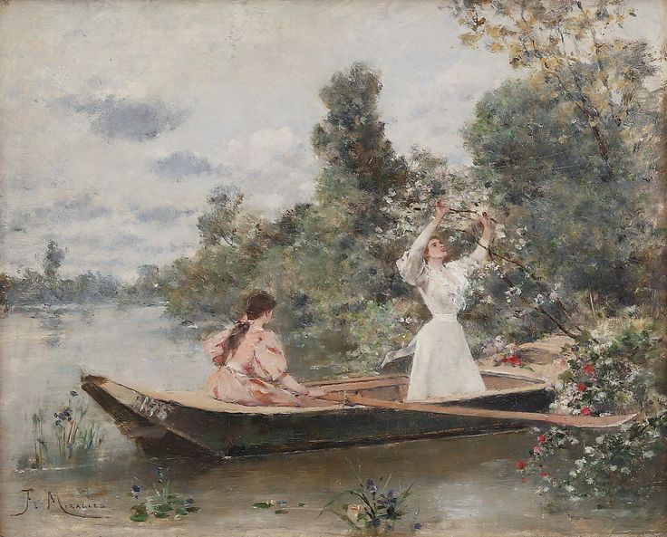 two women on a boat in the water with trees and flowers behind them, one woman holding a flower